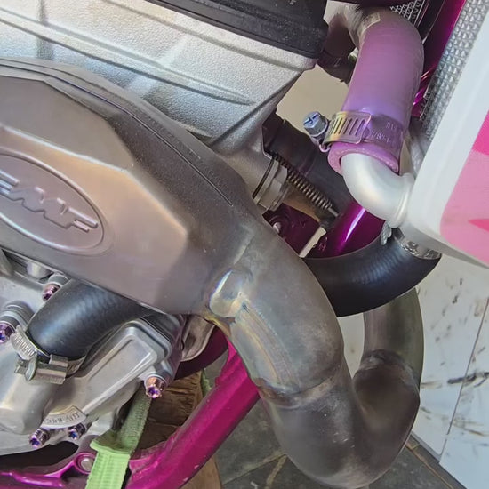 Close-up walkaround of pink-purple titanium bolts on Isla's pink-frame Husqvarna FC 250
