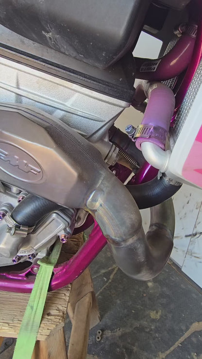 Close-up walkaround of pink-purple titanium bolts on Isla's pink-frame Husqvarna FC 250